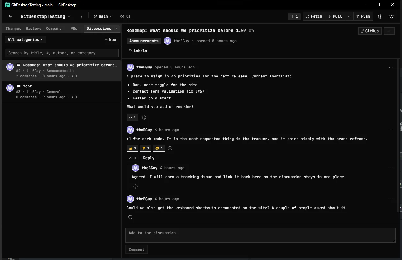 A GitHub Discussion in GitDesktop: a roadmap thread with a category, an upvote count, reactions, and a threaded reply